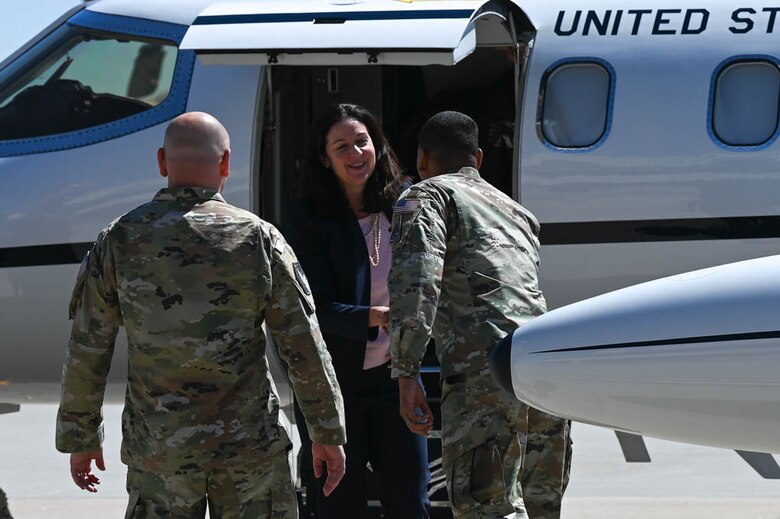 Woman steps off of plane
