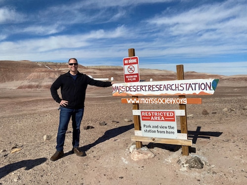 Master Sgt. Nicholas Pender, an Air Force Institute of Technology Education with Industry fellow, stands next to the sign marking the location of the American Public University System Analog Research Group’s first analog astronaut mission. Pender served as health and safety officer for the mission at Mars Desert Research Station in Hanksville, Utah. (Contributed photo)