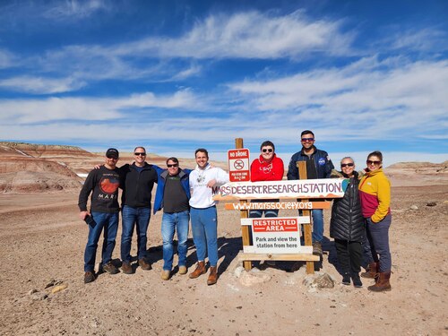 The crew of American Public University System Analog Research Group’s first analog astronaut mission stands next to the sign marking The Mars Society’s Mars Desert Research Station in in Hanksville, Utah. The team included (from left): Bill O’Hara, habitat specialist; Master Sgt. Nicholas Pender, health and safety officer; engineer Alexis Lojek, heliophysicist Noah Loy; Tyler Hines, green habitat officer; Tony DiBernardo, crew journalist; astronomer Salina Pena and commander Sarah Guthrie. (Contributed photo)