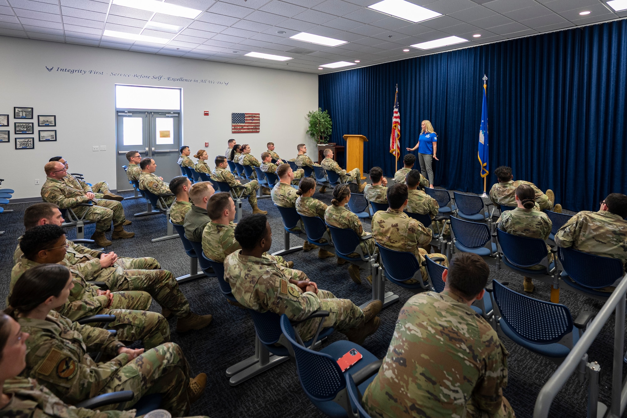 A photo of a speaker briefing a crowd