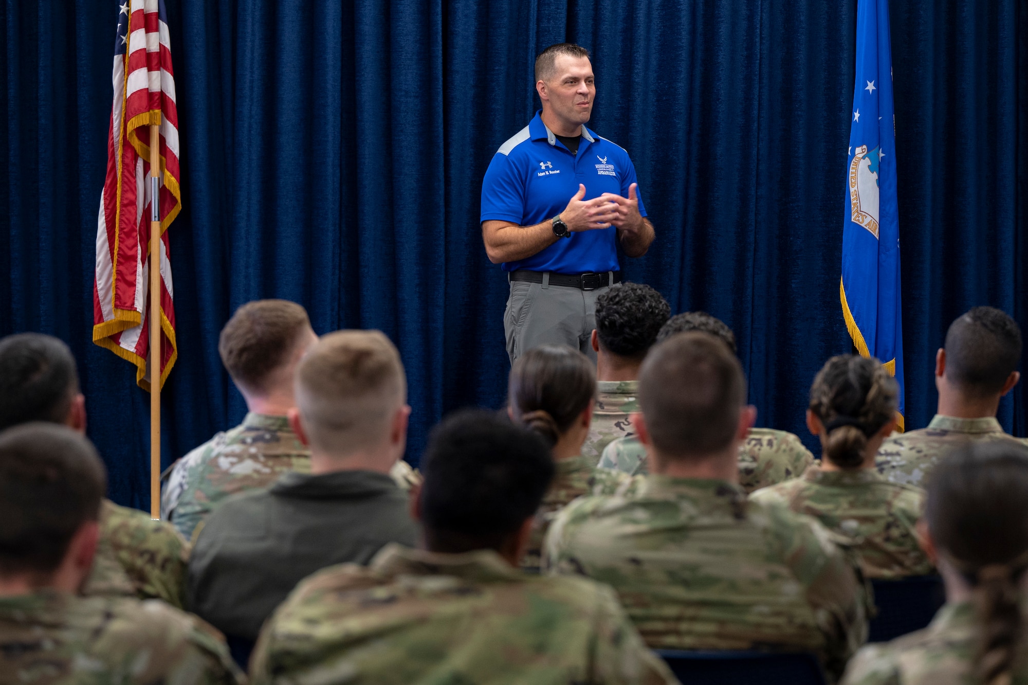 A photo of a speaker briefing a crowd