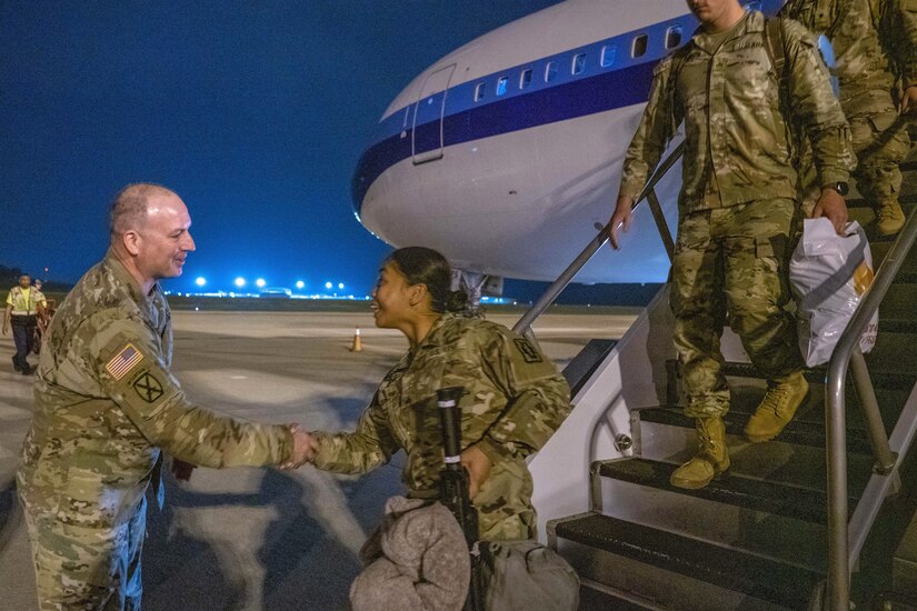 Maj. Gen. James G. McCormack, left, assistant adjutant general, Pennsylvania National Guard, welcomes Soldiers from the 252nd Quartermaster Co. who had just returned from a deployment to the Middle East on April 5, 2023, at Killeen-Fort Hood Regional Airport in Texas. (U.S. Army photo by Eric Franklin)
