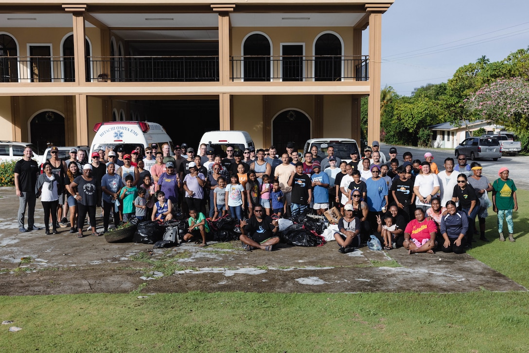 U.S. Marines from 7th Engineer Support Battalion assigned to Marine Corps Engineer Detachment - Palau, and Peleliu locals pose for a group photo after a town clean up at Peleliu, Republic of Palau, March 18, 2023. Peleliu locals and Marines with MCED-Palau arranged a town clean up to help keep the environment safe and clean but to also help reduce pollution and litter. During this rotational deployment, Marine Corps Engineers and Navy Seabees continue to improve interoperability with the Indo-Pacific by undertaking infrastructure projects which benefit local populations and enhance the United States’ ability to render support and aid in response to disasters or other crises. (U.S. Marine Corps photo by Cpl. Casandra Lamas)