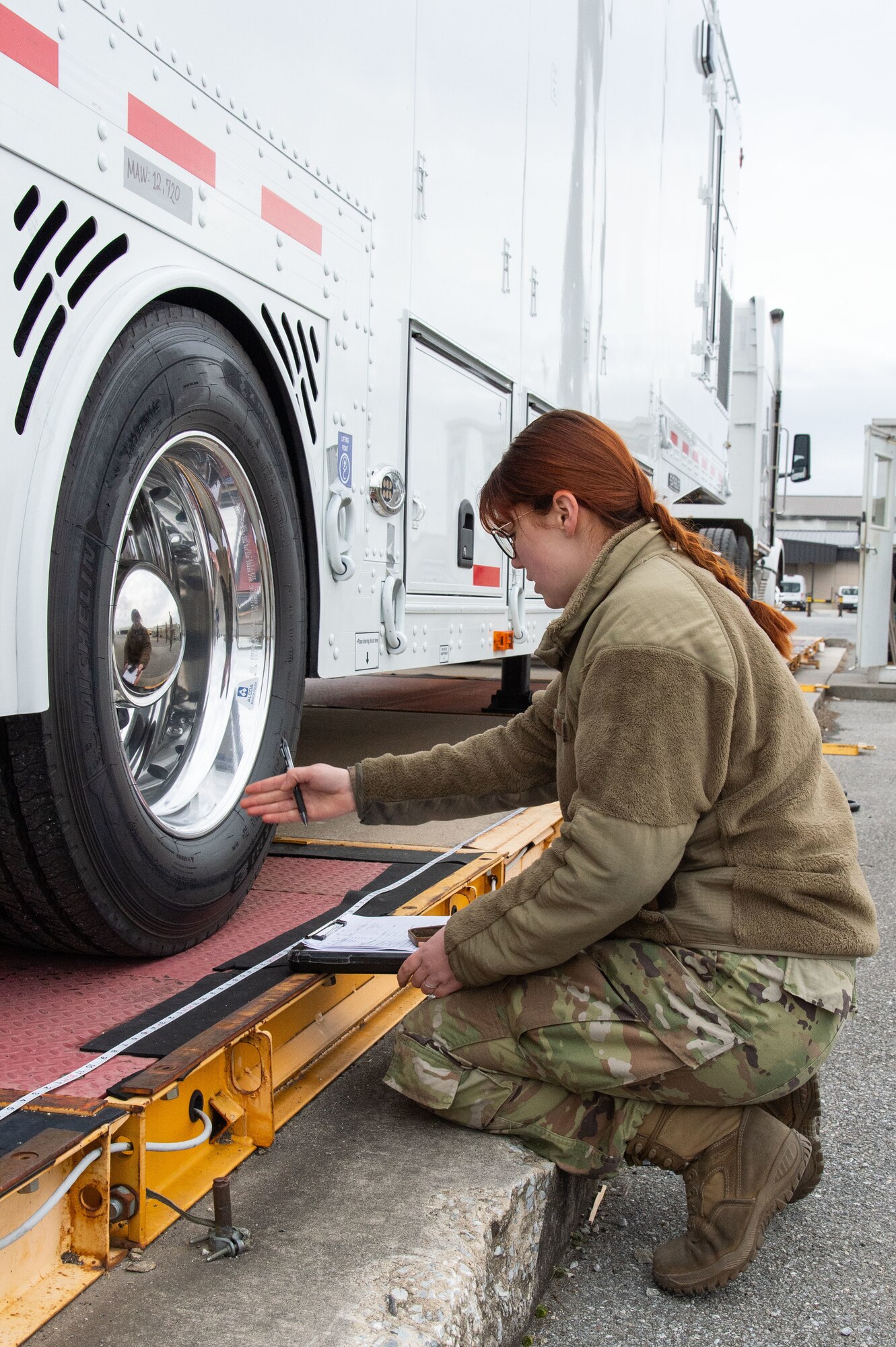 Staff Sgt. Dominique Flagg, 436th Aerial Port Squadron special handling journeyman, records weight and length measurements of a Mobile Remote Quick Look trailer at Dover Air Force Base, Delaware, Jan. 30, 2023. Flagg and her team of special handling processors prepared shipping documentation prior to loading the trailer on a C-17 Globemaster III. (U.S. Air Force photo by Roland Balik)