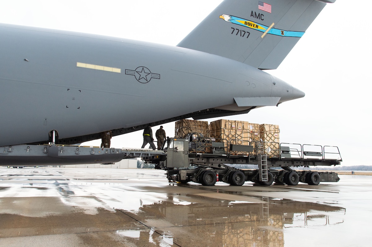 Forward Operating Base equipment for the MQ-4C Triton Orbit 1operations is loaded onto a C-17 Globemaster III by 436th Aerial Port Squadron personnel at Dover Air Force Base, Delaware, Feb. 1, 2023. The FOB equipment and a Mobile Remote Quick Look trailer was flown to Andersen AFB, Guam by a 3rd Airlift Squadron aircrew delivering both items to support U.S. Navy operations. (U.S. Air Force photo by Roland Balik)