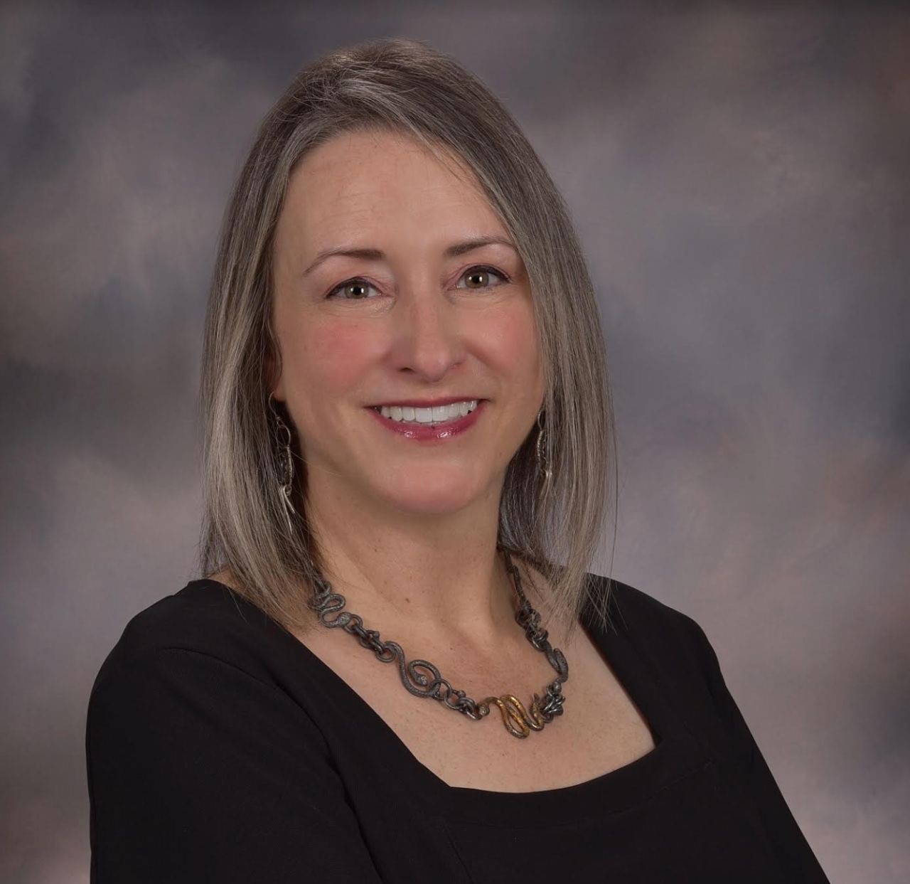 Naval Oceanography is home to the U.S. Navy’s first female Director at the Navy DoD Supercomputing Resource Center (DSRC), Ms. Christine Cuicchi. Considering the vast amounts of data collected, analyzed and distributed around the globe through Naval Oceanography’s unique capabilities and techniques, the agency is fortunate the tall order of business and technical skill to manage and store that data rests in the hands of Cuicchi. 

Upon first look at her professional accomplishments of operating the DoD’s largest supercomputer; or challenging leadership roles where Cuicchi shepherds 30 petaFLOPs  of computing power to over 3,000 RDT&E, S&T*, and acquisition professional throughout DoD—it is obvious her professional posture is grand and proven. Yet, the full extent of Cuicchi’s superpowers exceed beyond technical skills; it’s her effect on people that seems to be as impressive as her professional-self. 
(*Research, Development, Test & Evaluation, Science & Technology)