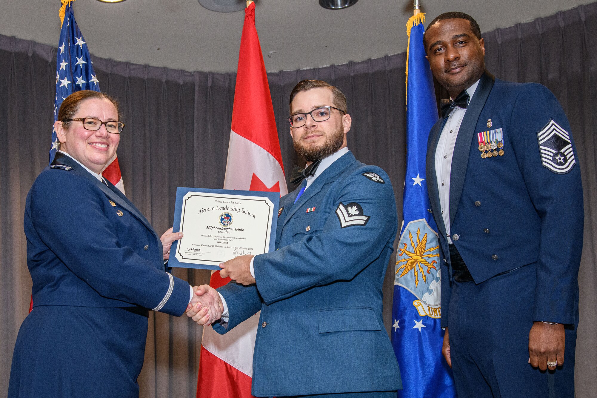 Airmen and aviators pose for a photo
