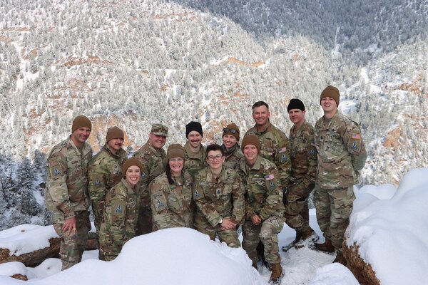 PETERSON SPACE FORCE BASE, Colorado - Members of Space Delta 3's Quick Reaction Force pose for a photo at the summit of Mt. Muscoco. The QRF completed the Crucible event—a 4-mile, 1,292 ft. elevation gain hike—on April 6 where the team transported a 500+ pound Electromagnetic Warfare system and set up operations mountain-side, proving the agility and mobility of both the developmental system and the team. (Courtesy Photo)