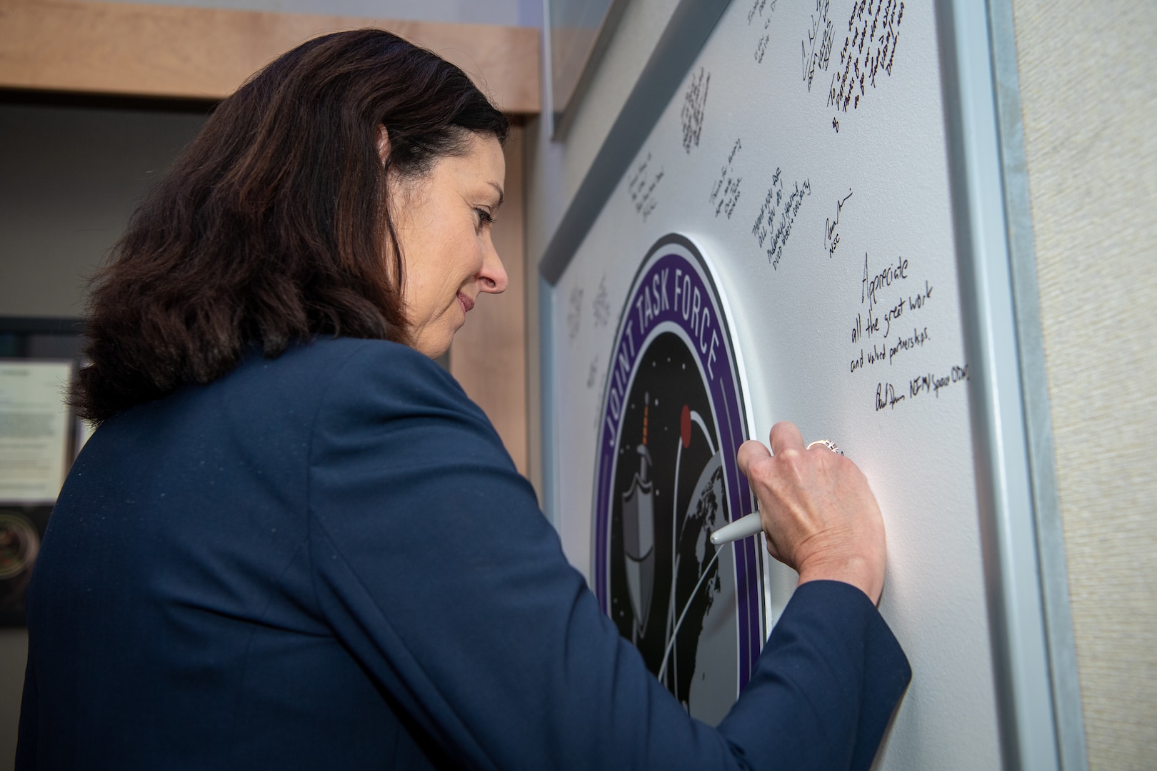 Woman signing board