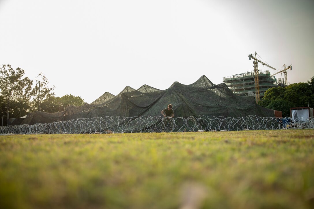 U.S. Marines with 3d Marine Littoral Regiment, 3d Marine Division, set up concertina wire in preparation for Balikatan 23 at Fort Bonifacio, Philippines, April 6, 2023. Balikatan is an annual exercise between the Armed Forces of the Philippines and U.S. military designed to strengthen bilateral interoperability, capabilities, trust, and cooperation built over decades of shared experiences.