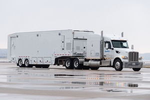 A Mobile Remote Quick Look trailer, used by the U.S. Navy, drives down the flight line at Dover Air Force Base, Delaware, Feb. 1, 2023. The RQL trailer was transported to Andersen AFB, Guam in support of the U.S. Navy MQ-4C Triton Orbit 1 operation. The MQ-4C is an unmanned aerial vehicle operated by the U.S. Navy for maritime patrol supporting intelligence, surveillance and reconnaissance operations. (U.S. Air Force photo by Roland Balik)