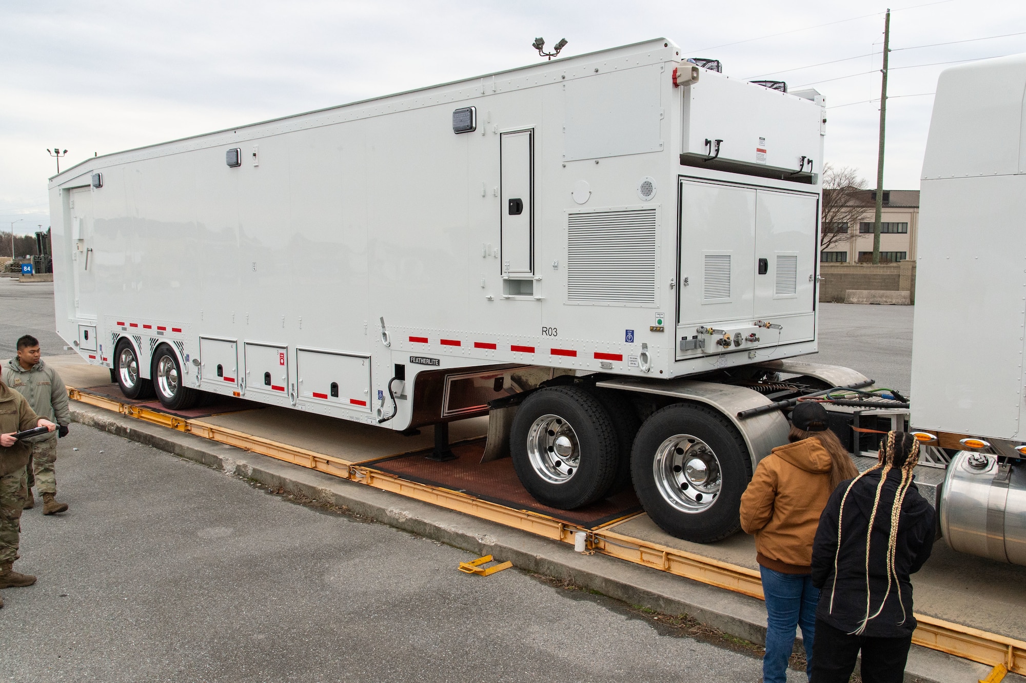 A Mobile Remote Quick Look trailer is positioned for weighing at the 436th Aerial Port Squadron marshalling yard on Dover Air Force Base, Delaware, Jan. 30, 2023. Special handling processors documented the trailer’s length, weight and center of balance before loading on a C-17 Globemaster III. (U.S. Air Force photo by Roland Balik)