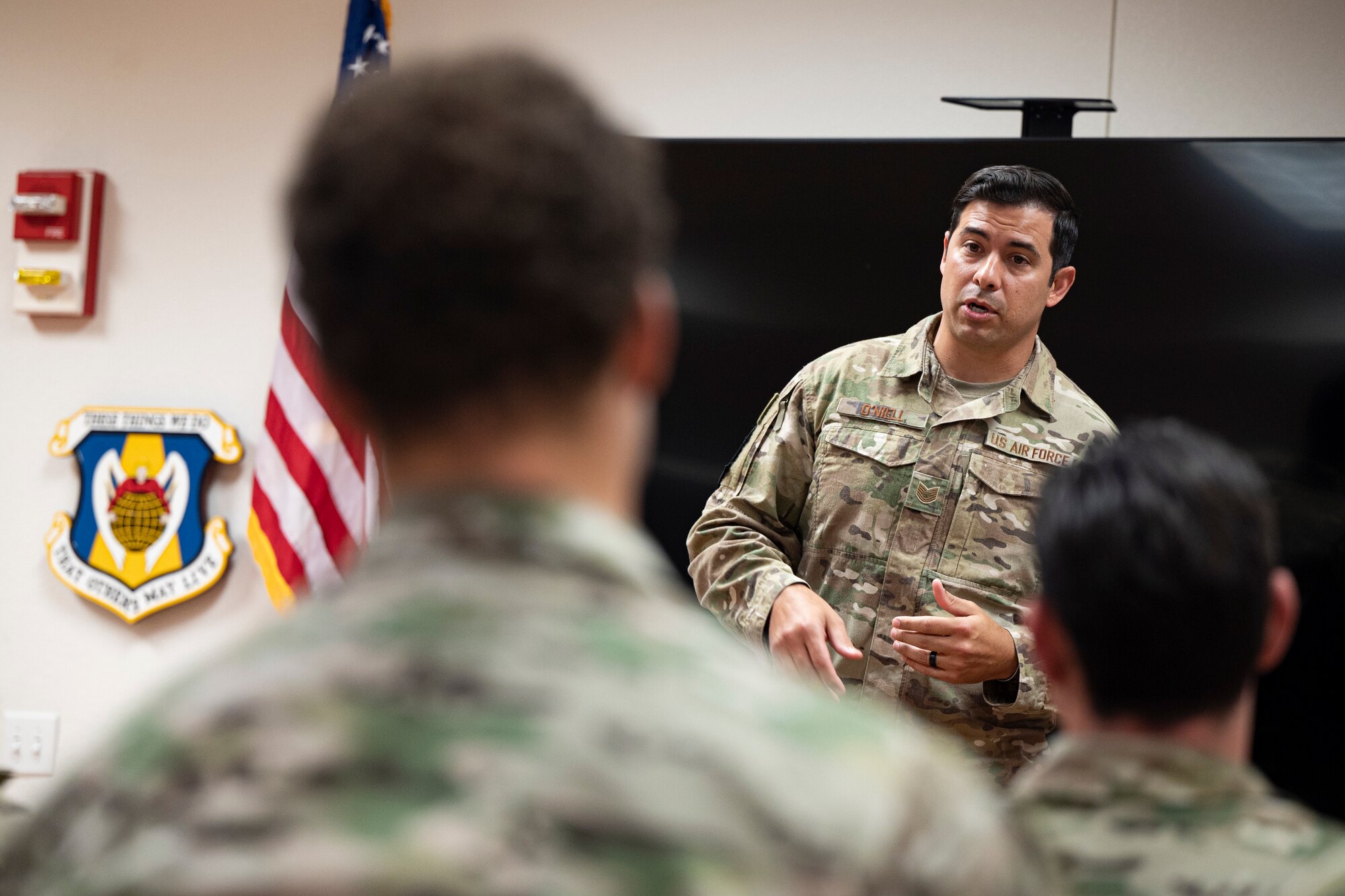 A photo of a speaker briefing a crowd