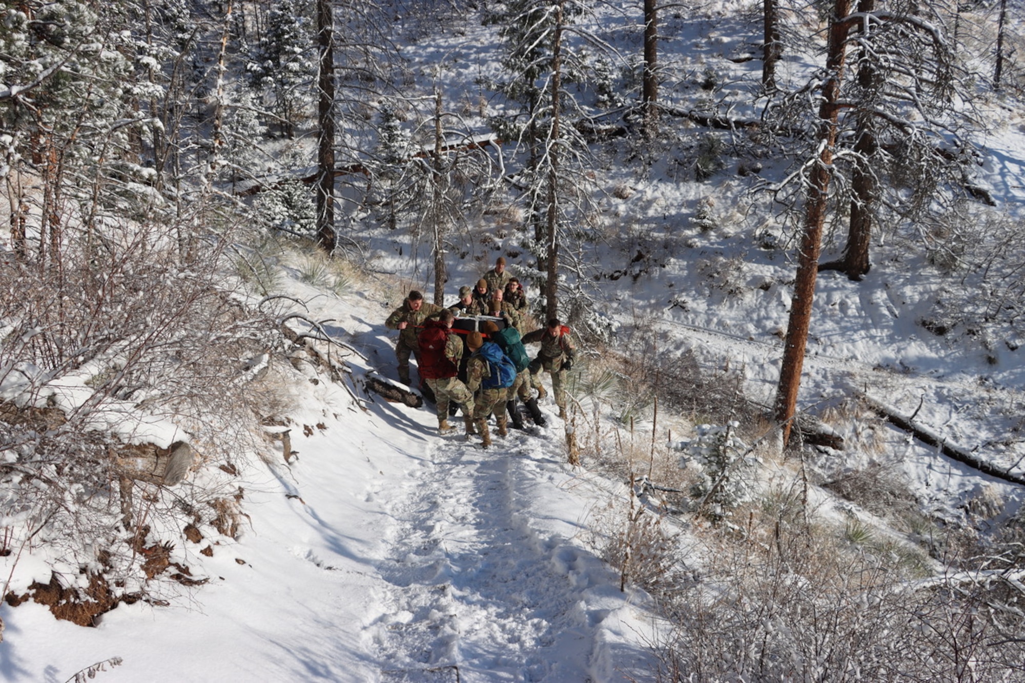 PETERSON SPACE FORCE BASE, Colorado - Members of Space Delta 3's Quick Reaction Force pose for a photo on Mt. Muscoco. The QRF completed the Crucible event—a 4-mile, 1,292 ft. elevation gain hike—on April 6 where the team transported a 500+ pound Electromagnetic Warfare system and set up operations mountain-side, proving the agility and mobility of both the developmental system and the team. (Courtesy Photo)