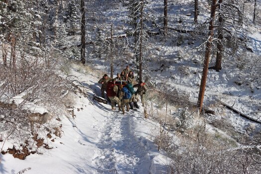  PETERSON SPACE FORCE BASE, Colorado - Members of Space Delta 3's Quick Reaction Force pose for a photo on Mt. Muscoco. The QRF completed the Crucible event—a 4-mile, 1,292 ft. elevation gain hike—on April 6 where the team transported a 500+ pound Electromagnetic Warfare system and set up operations mountain-side, proving the agility and mobility of both the developmental system and the team. (Courtesy Photo)