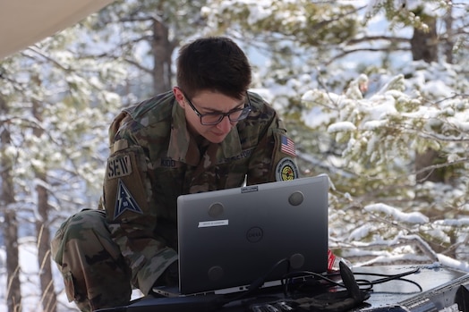  PETERSON SPACE FORCE BASE, Colorado - A Member of Space Delta 3's Quick Reaction Force assists in setting up the Electromagnetic Warfare system. The QRF completed the Crucible event—a 4-mile, 1,292 ft. elevation gain hike—on April 6 where the team transported a 500+ pound Electromagnetic Warfare system and set up operations mountain-side, proving the agility and mobility of both the developmental system and the team. (Courtesy Photo)
