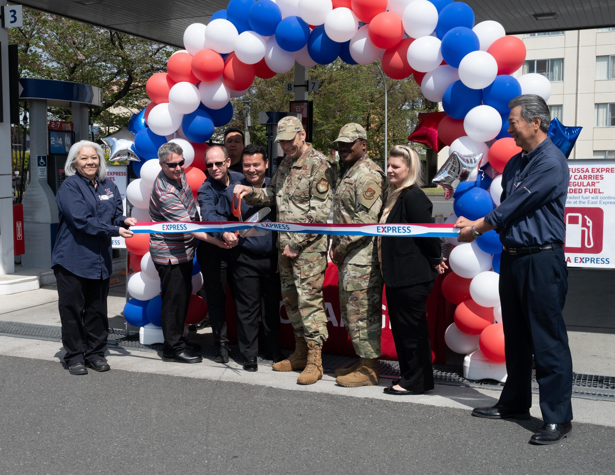 Base Leadership and AAFES employees help cut the rope.