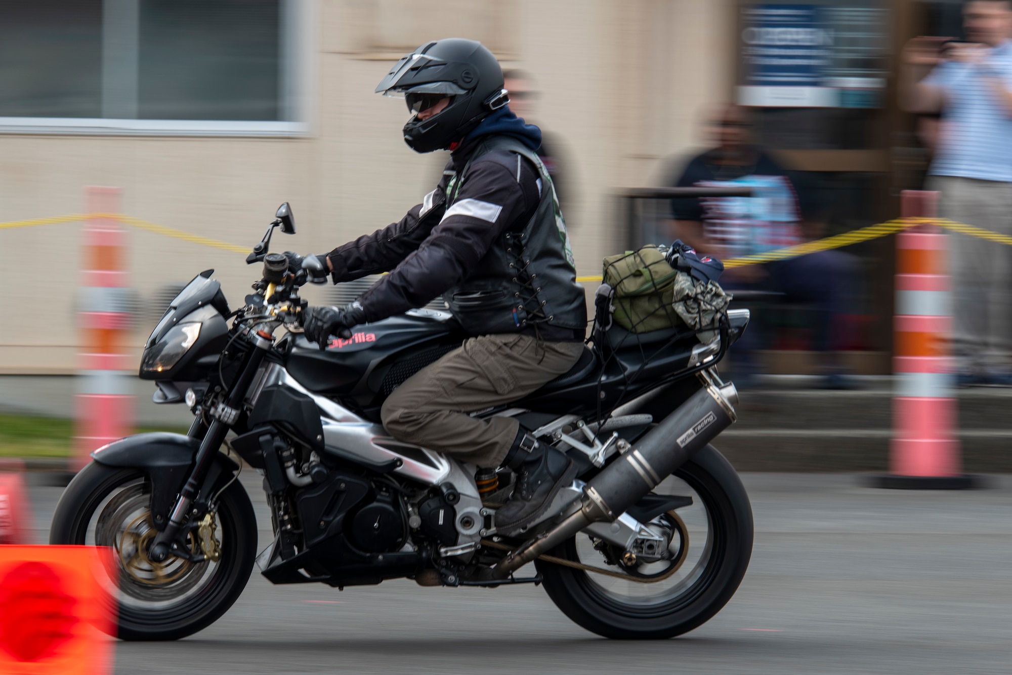 A closeup of a motorcycle rider as he zooms past