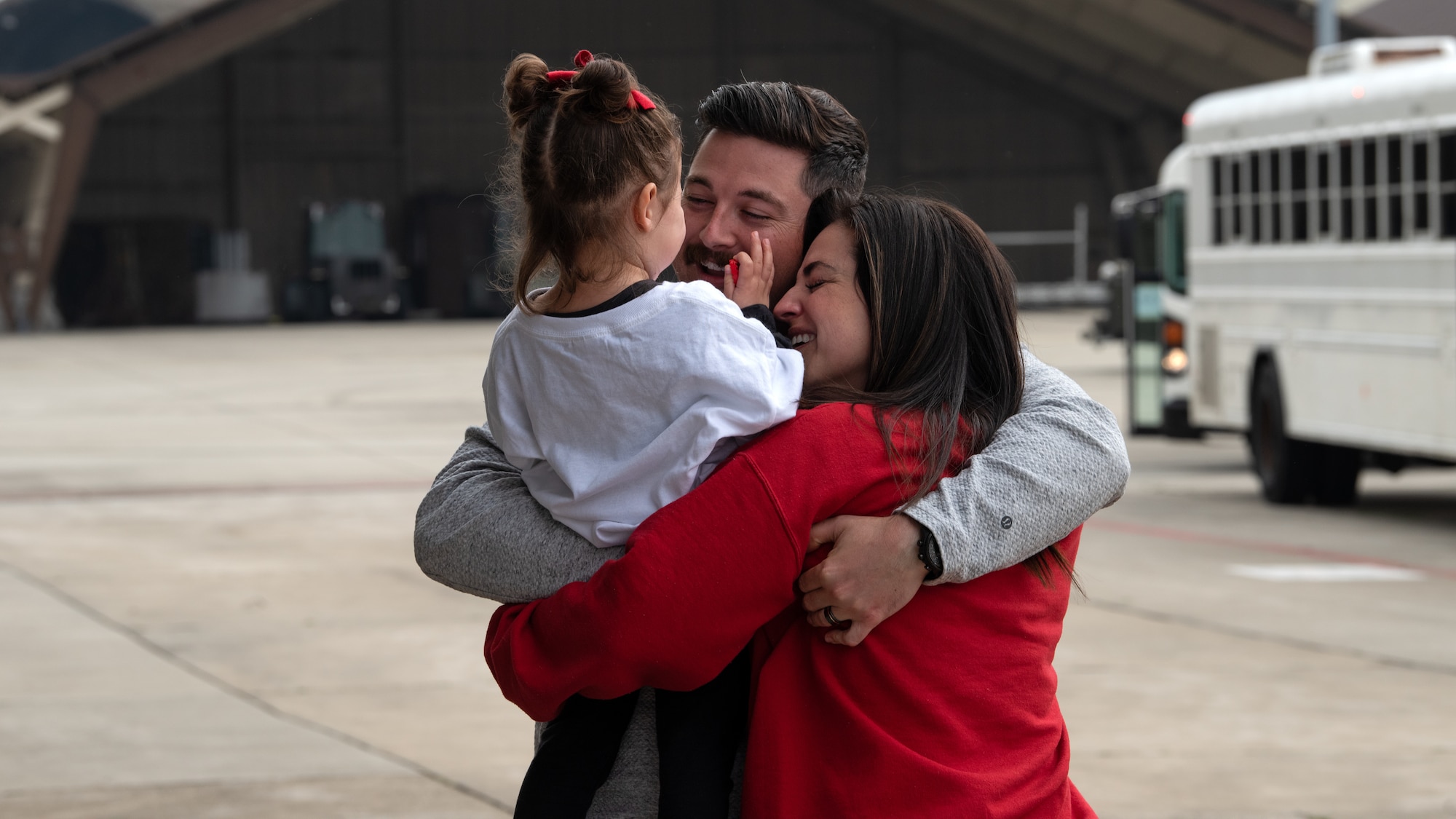 Family members greet a returning Airman.