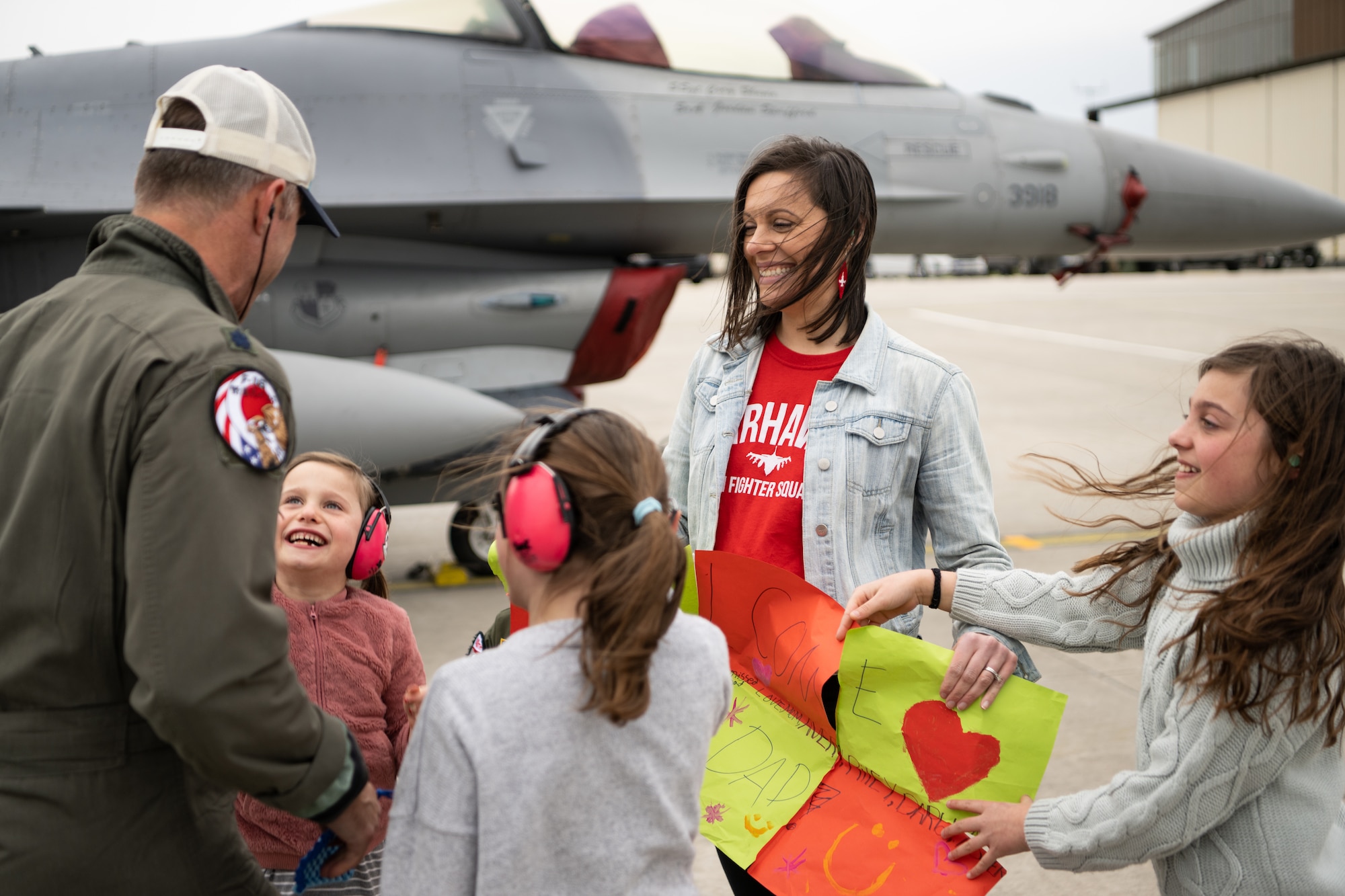 Family members greet a returning pilot