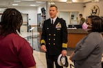 Capt. James Prouty, commanding officer of Navy Reserve Center Norfolk, visits a military entrance processing station.