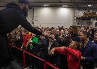 TYRRHENIAN SEA (March 25, 2023) Blanco Brown, performing artist, performs for Sailors aboard the Nimitz-class aircraft carrier USS George H.W. Bush (CVN 77) during a USO concert, March 25, 2023. The George H.W. Bush Carrier Strike Group is on a scheduled deployment in the U.S. Naval Forces Europe area of operations, employed by U.S. Sixth Fleet to defend U.S., allied and partner interests.