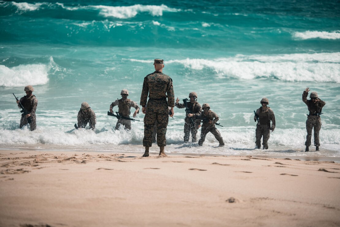 U.S. Marine Corps Gunnery Sgt. Trevor Schilling, air traffic control radar technician, Marine Corps Air Station Kaneohe Bay, leads physical training as part of MCAS Kaneohe Bay Corporals Course 2-23, Marine Corps Base Hawaii, April 10, 2023. The course was held to provide Marine noncommissioned officers with the skills and knowledge necessary to become successful small-unit leaders.