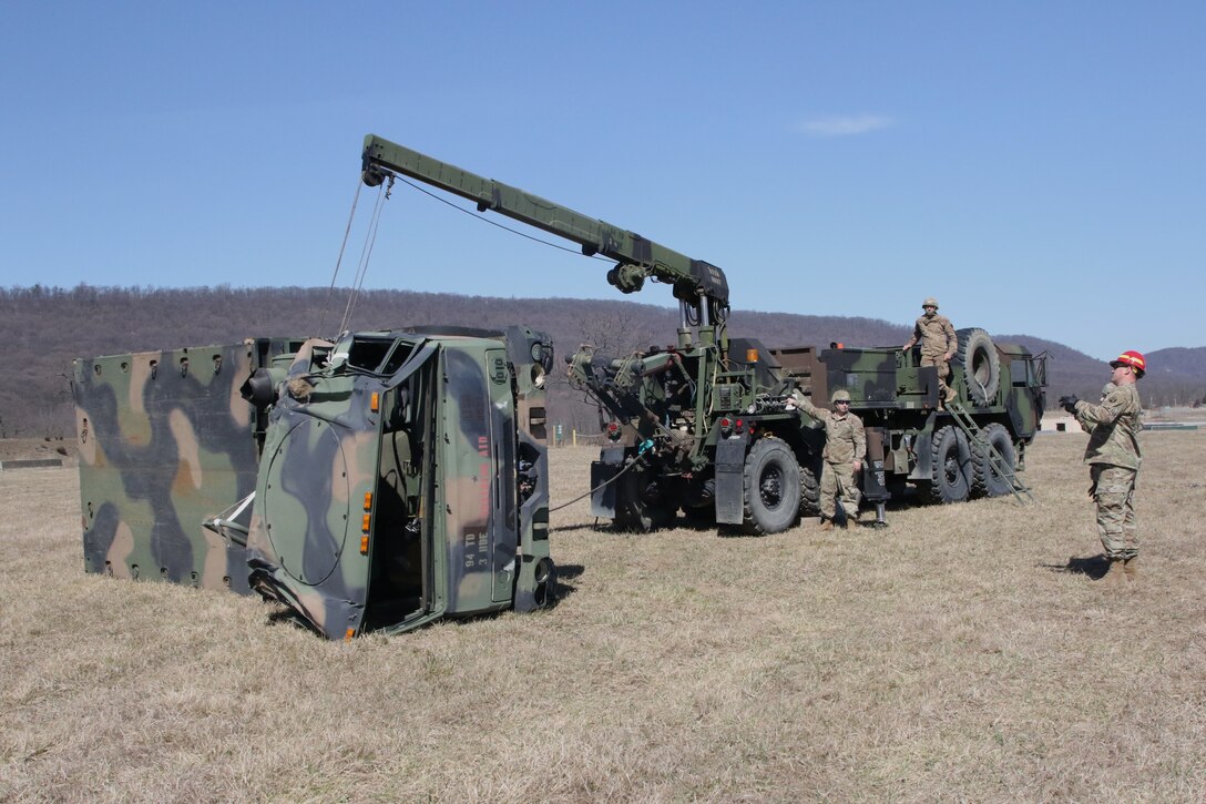 94th Training Division instructors walk Soldiers through recovering an overturned vehicle using the single crane method.
The 80th Training Command’s Regional Training Maintenance Site Fort Indian Town Gap graduated its most recent class of Wheeled Recovery Specialists, also known by the designation H8 (pronounced as “Hotel-8”)