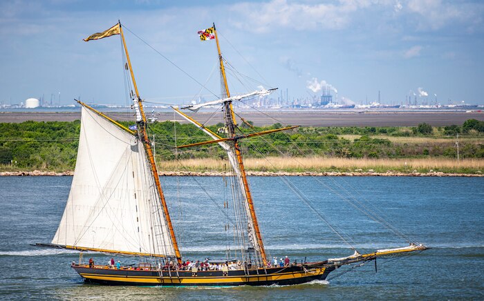 Pride of Baltimore 2, a square-topsail schooner and reconstruction of an early 19th-century Baltimore Clipper, transits Galveston Channel during Tall Ships Challenge Galveston 2023.