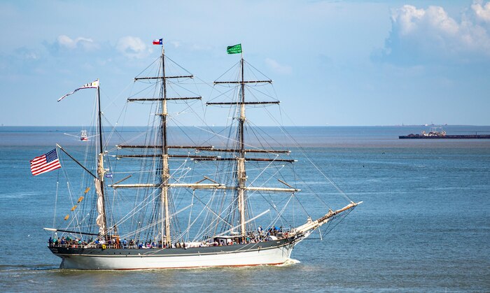 Elissa, a three-masted barque and one of three ships of her kind still active, transits Galveston Channel during Tall Ships Challenge Galveston 2023.