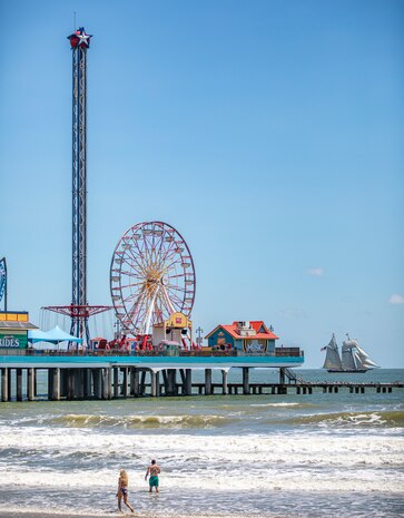 Pride of Baltimore 2, a square-topsail schooner and reconstruction of an early 19th-century Baltimore Clipper, transits the Gulf of Mexico off the coast of Galveston Beach near Pleasure Pier during Tall Ships Challenge Galveston 2023.