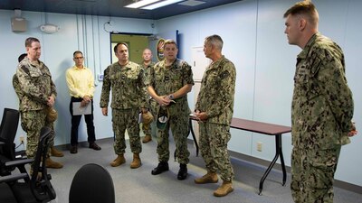 YOKOSUKA, Japan (April 7, 2023) Rear Adm. Pete Garvin, commander, Naval Education and Training Command (NETC), tours training classrooms at the Surface Combat Systems Training Command (SCSTC) Detachment Western Pacific onboard Commander, Fleet Activities Yokosuka. NETC’S mission is to recruit, train and deliver those who serve our nation, taking them from street-to-fleet by forging civilians into highly skilled, operational and combat ready warfighters. (U.S. Navy photo by Mass Communication Specialist 1st Class Jamaal Liddell)