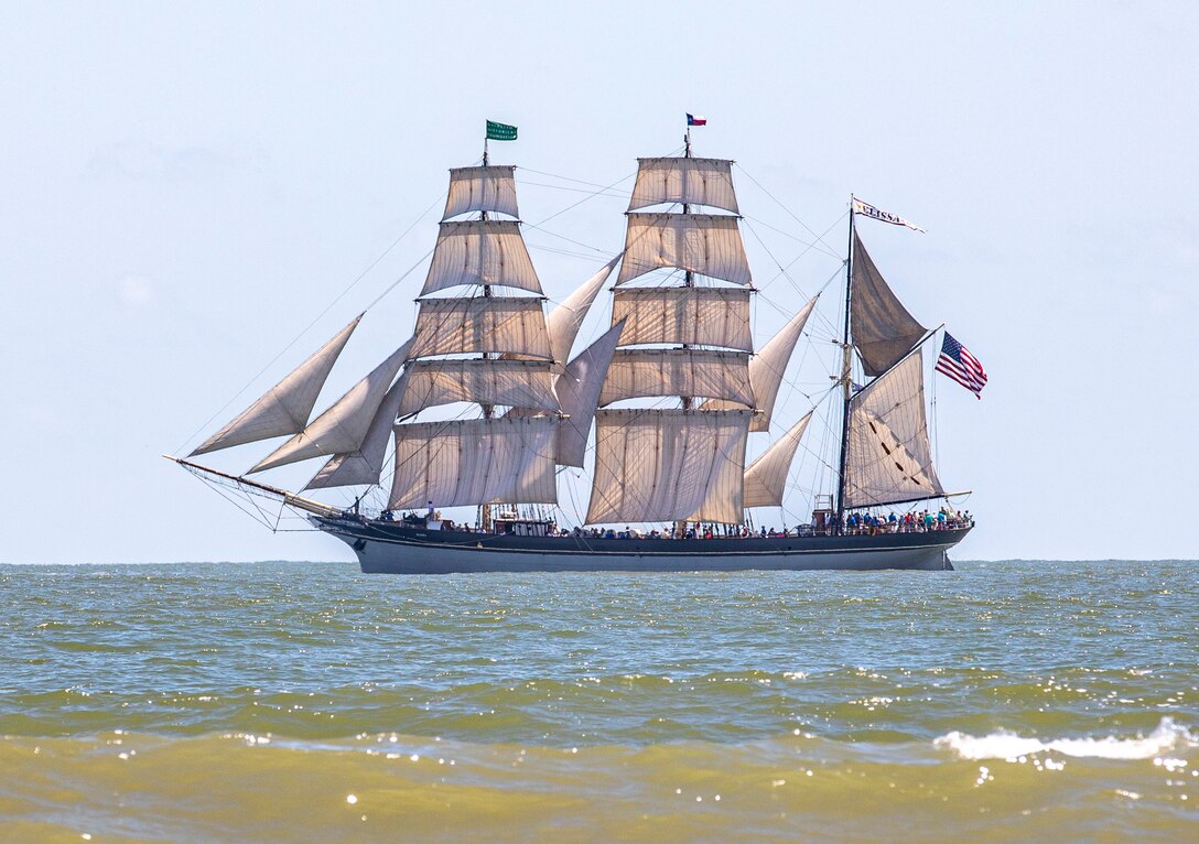 Elissa, a three-masted barque and one of three ships of her kind still active, transits the Gulf of Mexico off the coast of Galveston Beach during Tall Ships Challenge Galveston 2023.