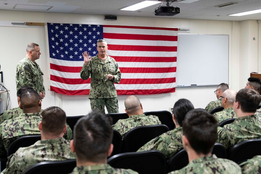 YOKOSUKA, Japan (April 7, 2023) Rear Adm. Pete Garvin, right, commander, Naval Education and Training Command (NETC), and Force Master Chief Rick Mengel, left, NETC’s force master chief, address Sailors during an all hands call at the NETC auditorium onboard Commander, Fleet Activities Yokosuka. NETC’S mission is to recruit, train and deliver those who serve our nation, taking them from street-to-fleet by forging civilians into highly skilled, operational and combat ready warfighters. (U.S. Navy photo by Mass Communication Specialist 1st Class Jamaal Liddell)