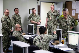 YOKOSUKA, Japan (April 7, 2023) Rear Adm. Pete Garvin, commander, Naval Education and Training Command (NETC), interacts with Information Warfare Training Site (IWTS) Sailors during a classroom tour at the Surface Combat Systems Training Command (SCSTC) detachment Western Pacific onboard Commander, Fleet Activities Yokosuka. NETC’S mission is to recruit, train and deliver those who serve our nation, taking them from street-to-fleet by forging civilians into highly skilled, operational and combat ready warfighters. (U.S. Navy photo by Mass Communication Specialist 1st Class Jamaal Liddell)