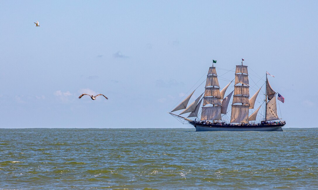 Elissa, a three-masted barque and one of three ships of her kind still active, transits the Gulf of Mexico off the coast of Galveston Beach during Tall Ships Challenge Galveston 2023.