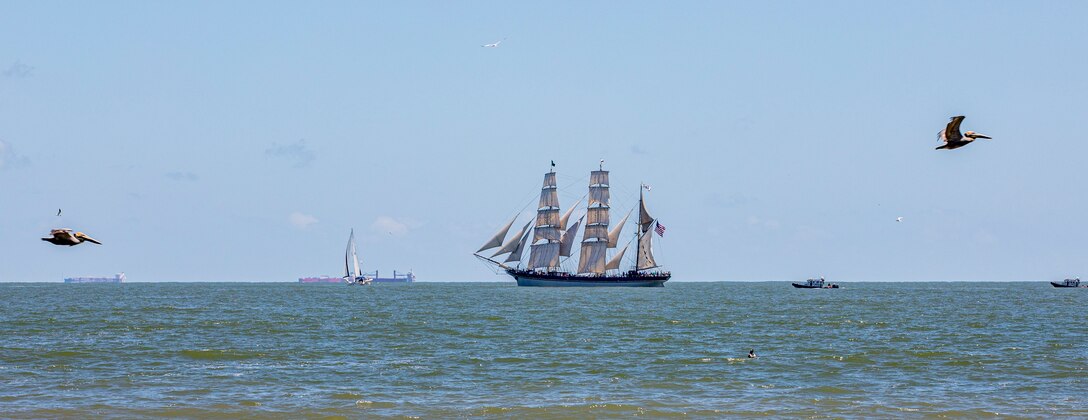 Elissa, a three-masted barque and one of three ships of her kind still active, transits the Gulf of Mexico off the coast of Galveston Beach during Tall Ships Challenge Galveston 2023.