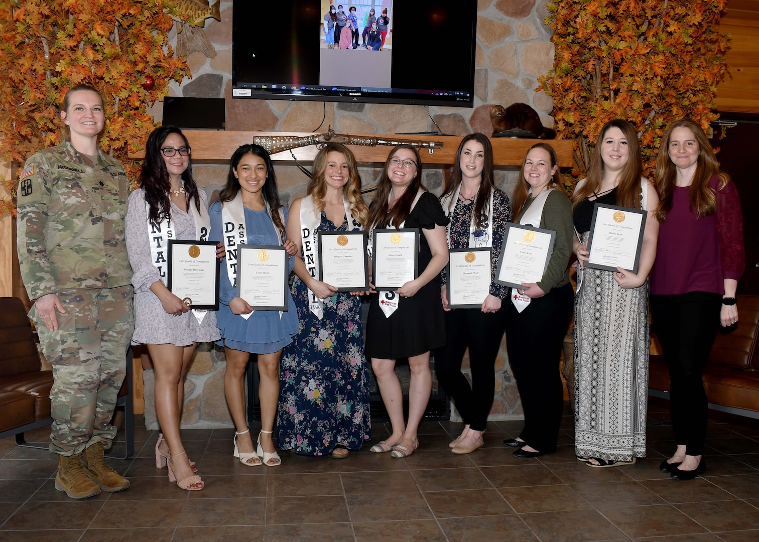 Students of the American Red Cross Dental Assistant training program stand with their certificates of completion during the program’s graduation ceremony at the Sportsman Lounge on Fort Drum, N.Y., April 6, 2023.