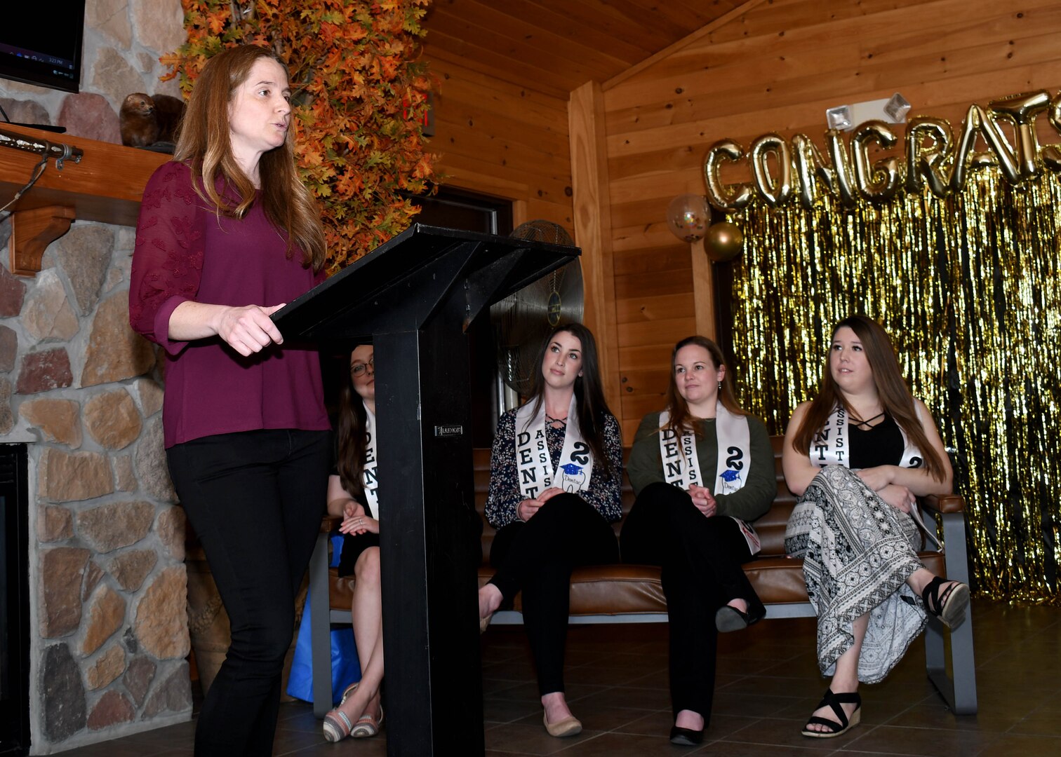 Jennifer Mapes, the service to the armed forces/international services regional program specialist with the American Red Cross, speaks during a graduation ceremony for American Red Cross Dental Assistant students at the Sportsman Lounge on Fort Drum, N.Y., April 6, 2023.