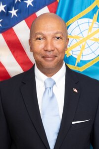 Portrait of a male civilian in front of the U.S. American flag