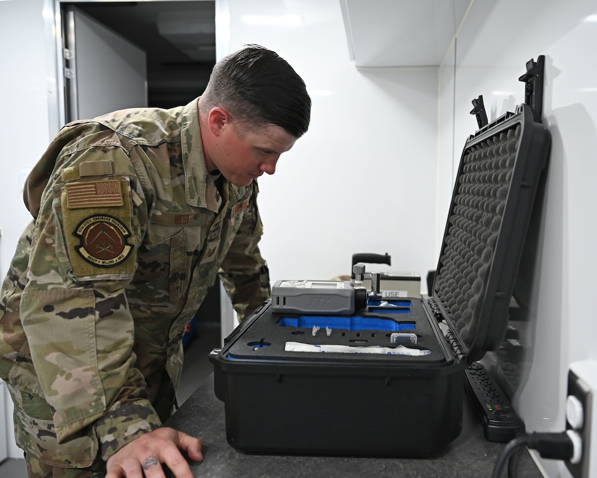 U.S. Air Force Tech. Sgt. Cody West, 17th Civil Engineer Squadron emergency management Non-Commissioned Officer in Charge, inspects the TruDefender FTX handheld chemical identification analyzer at Goodfellow Air Force Base, Texas, April 3, 2023. The TruDefender FTX, handheld chemical identification analyzers, enable effective incident response, providing fast, actionable information to mitigate potential threats. (U.S. Air Force photo by Airman 1st Class Zachary Heimbuch)