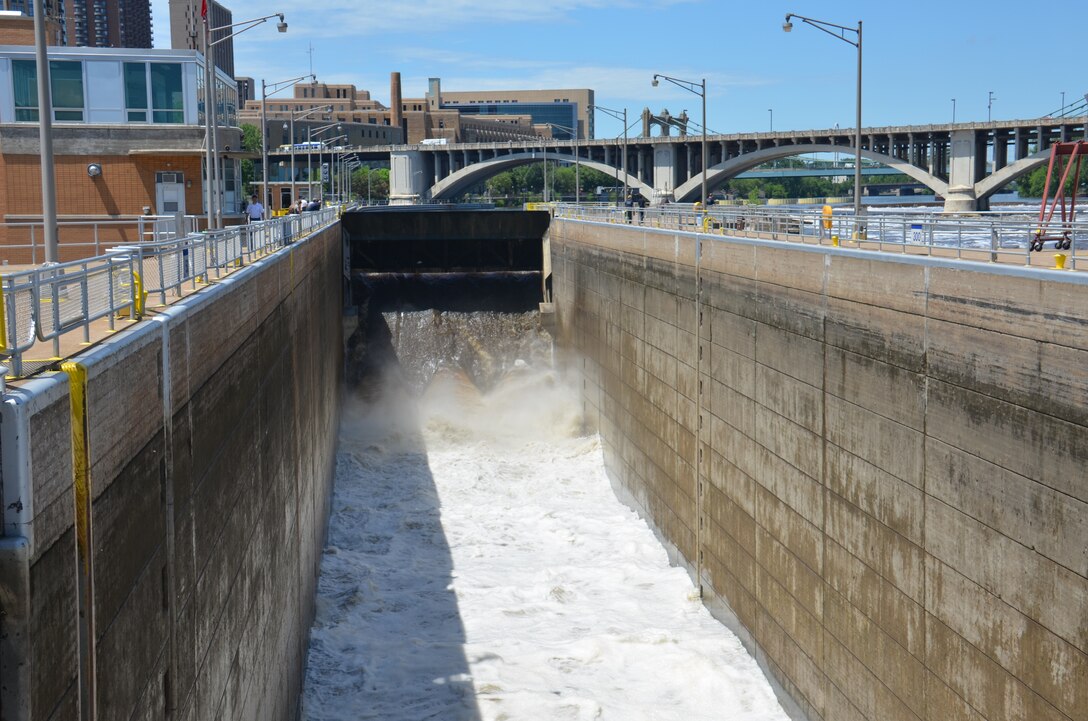 Water rushed through a lock chamber in downtown Minneapolis