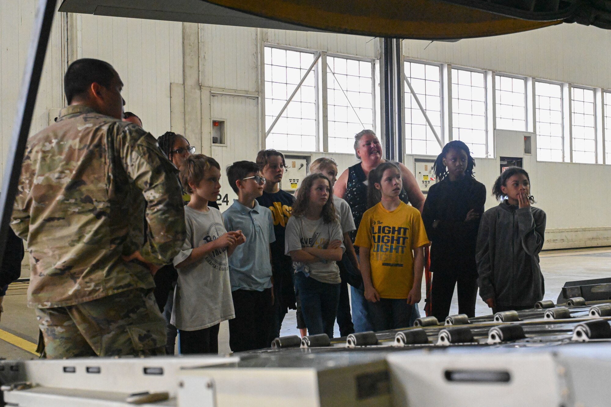 children explore a C-130J Super Hercules