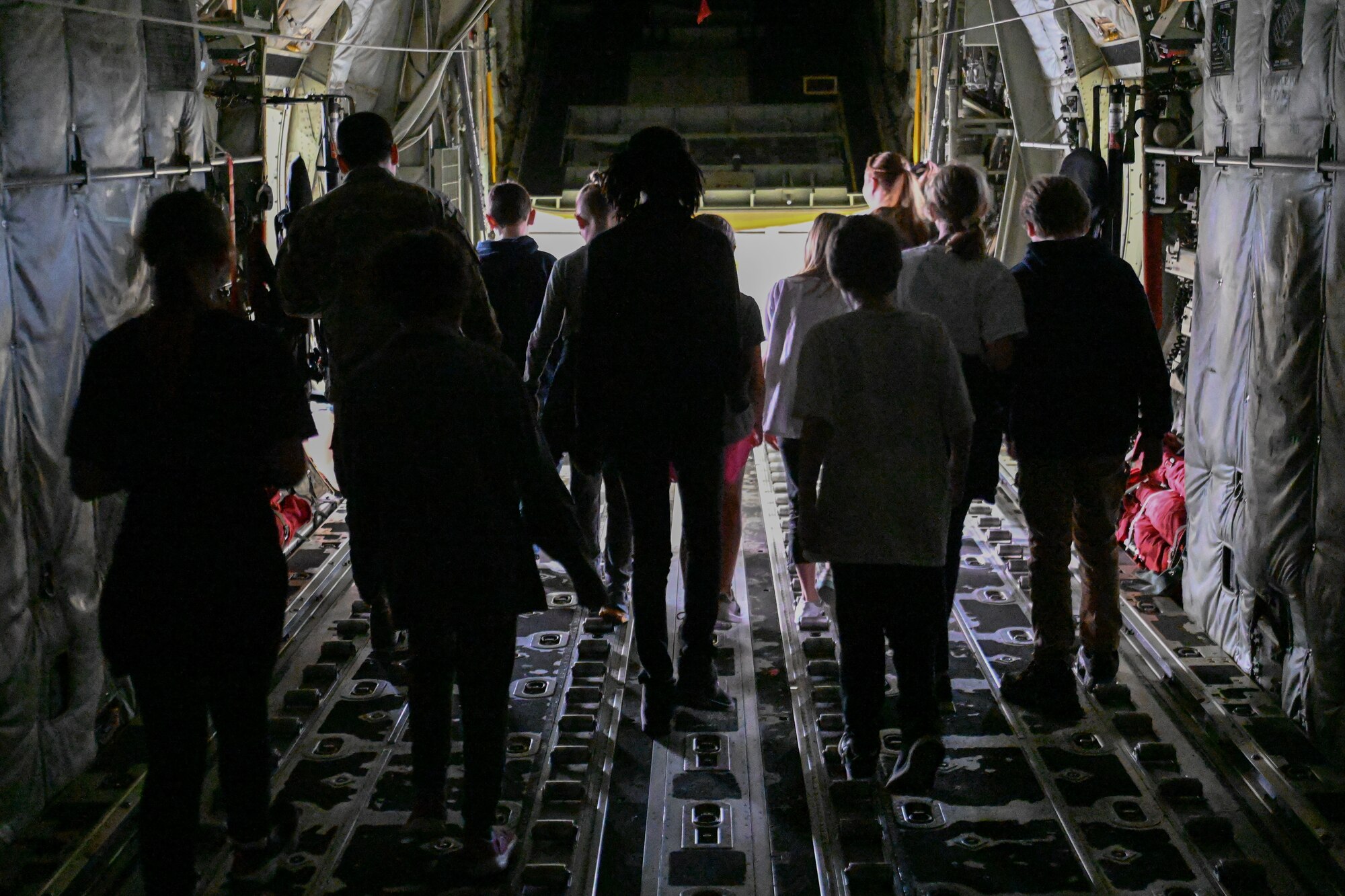 children explore a C-130J Super Hercules