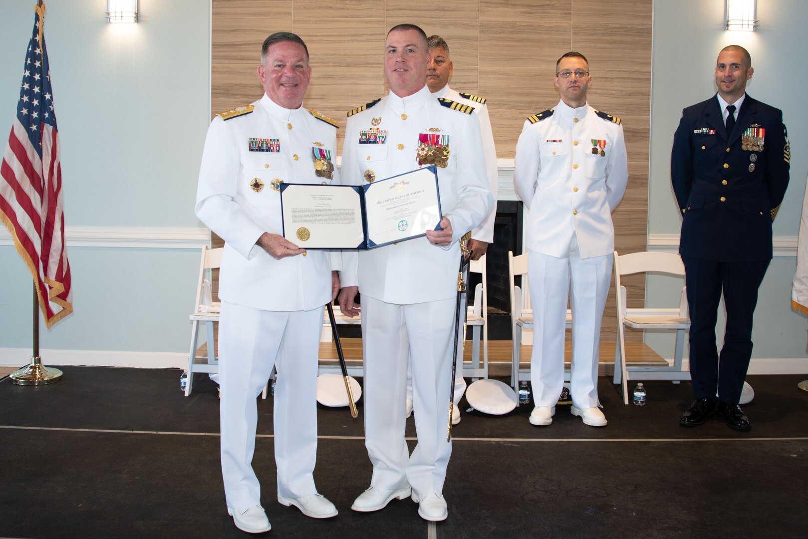 Coast Guard District Seven Commander Rear Adm. Brendan McPherson and Capt. John D. Cole pose for a photo in Charleston, South Carolina, April 14, 2023. Capt. Francis J. Del Rosso is assuming the duties and responsibilities of the commander of Coast Guard Sector Charleston from Capt. John D. Cole. (U.S. Coast Guard photo by Petty Officer 1st Class David Micallef)