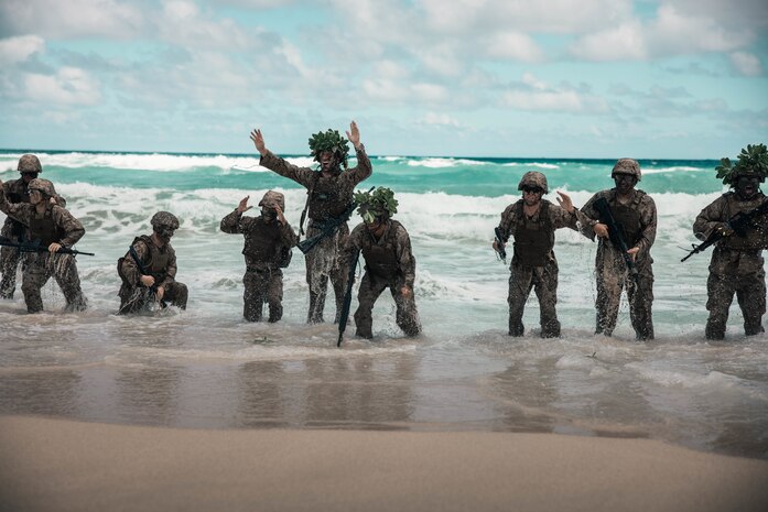 U.S. Marines stationed at Marine Corps Base Hawaii, participate in a physical training event as part of the Marine Corps Air Station Kaneohe Bay Corporals Course 2-23, MCBH, April 10, 2023. The course was held to provide Marine noncommissioned officers with the skills and knowledge necessary to become successful small-unit leaders. (U.S. Marine Corps photo by Lance Cpl. Clayton Baker)
