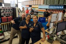 General Services Administration employees pose for a photo at a customer appreciation day, Marine Corps Base Hawaii, April 12, 2023. The purpose of the event was for vendors to discuss requirements with unit representatives and showcase new items and supplies. (U.S. Marine Corps photo by Chief Warrant Officer 2 William Faffler)