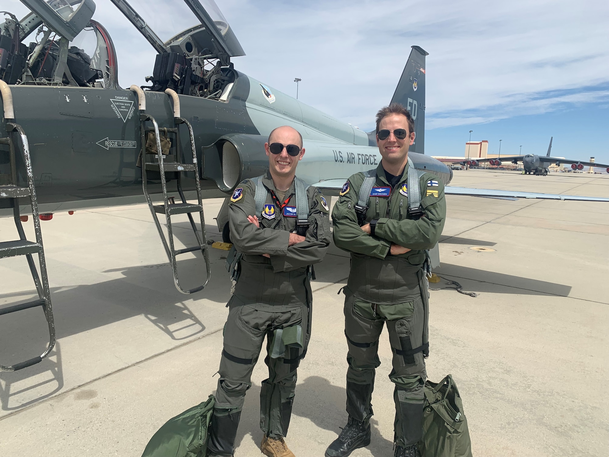 U.S. Air Force Test Pilot School Class 23A students Capt. Sami Nisonen of the Finnish Air Force and Capt. Jacob Olsen of the USAF pose for a photo after flying a T-38 Talon. This technical exchange would be the very first joint US - Finland flight operation after Finland officially joined the NATO defensive alliance.