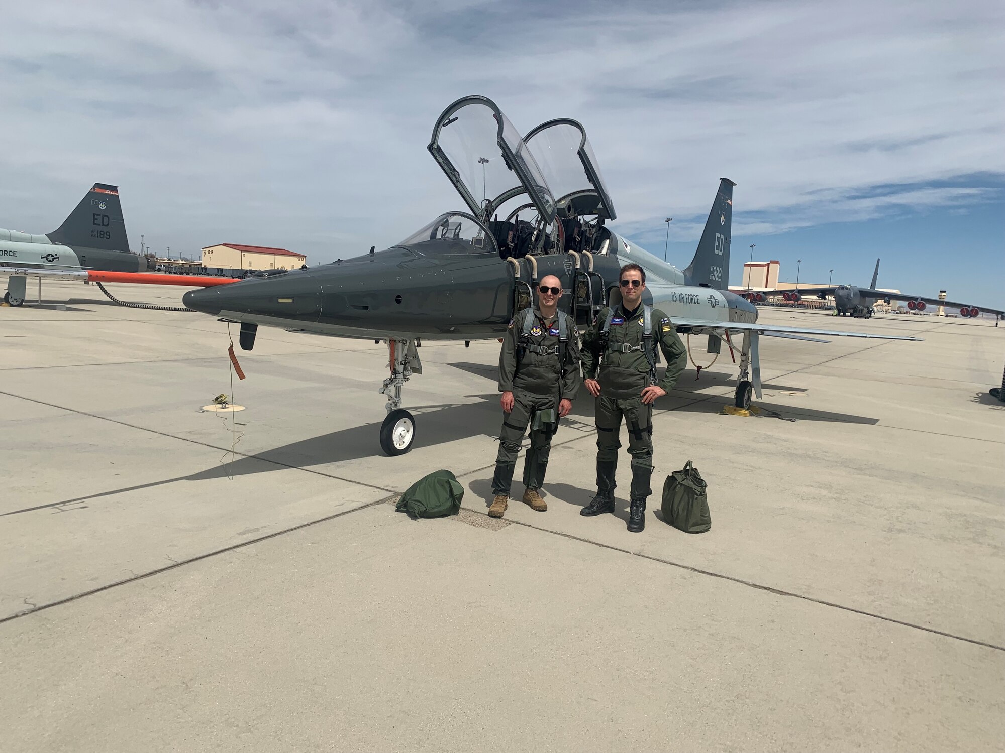 U.S. Air Force Test Pilot School Class 23A students Capt. Sami Nisonen of the Finnish Air Force and Capt. Jacob Olsen of the USAF pose for a photo after flying a T-38 Talon. This technical exchange would be the very first joint US - Finland flight operation after Finland officially joined the NATO defensive alliance.