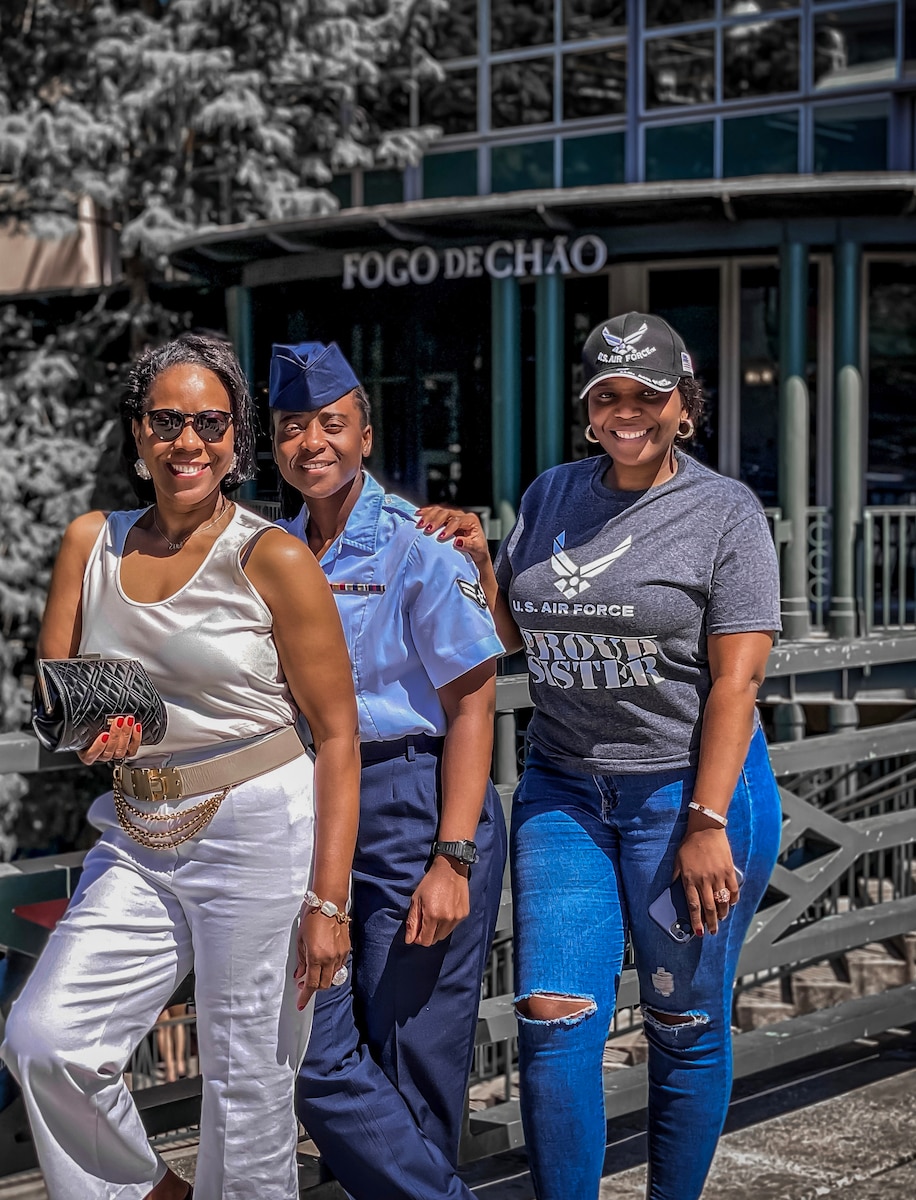 Image of three people posing for a photo.